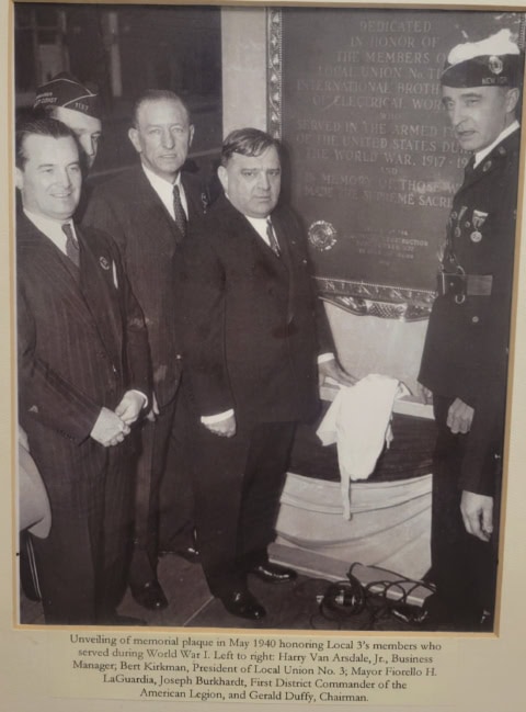 Unveiling memorial plaque honoring union members and veterans.