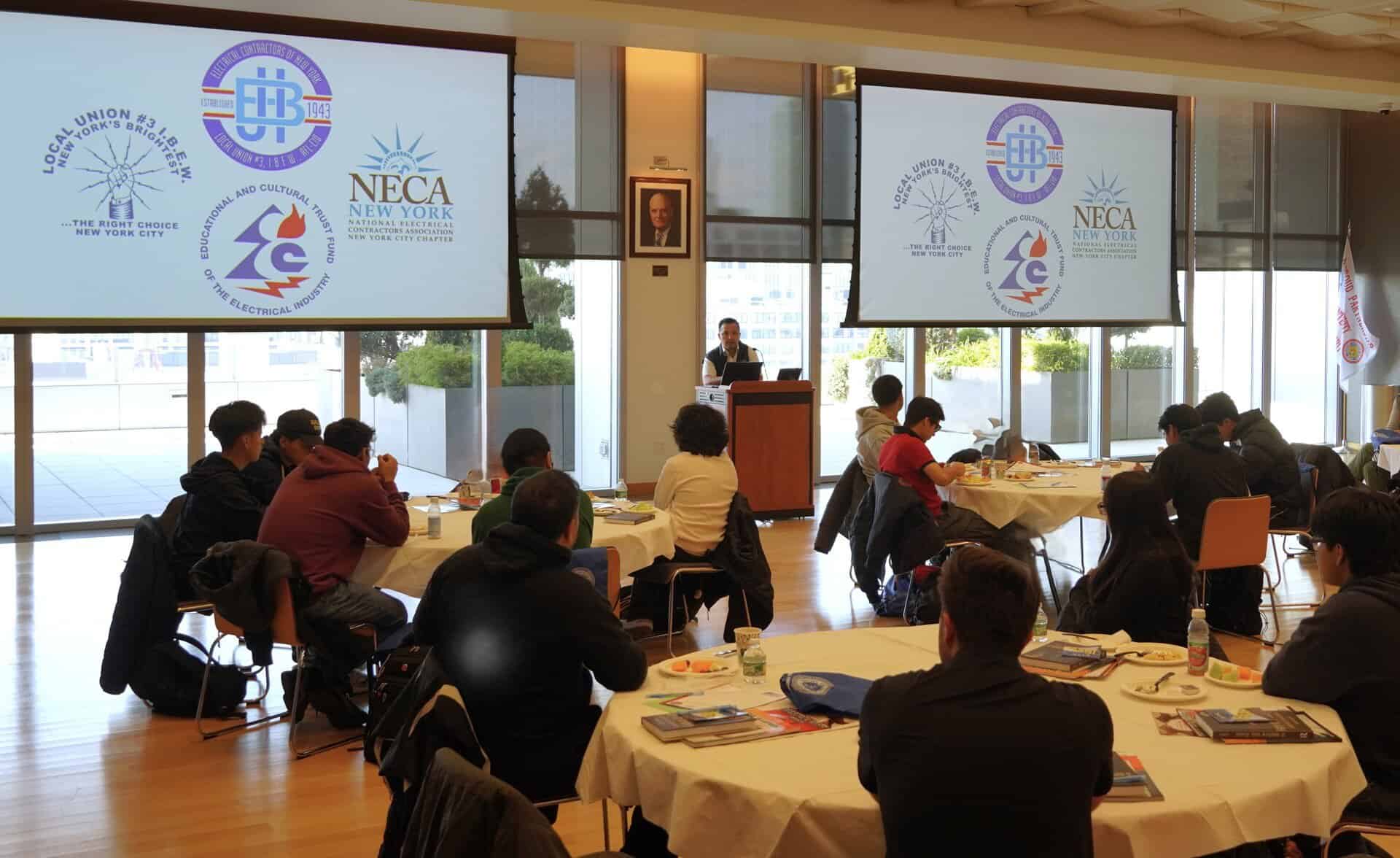 Industry professionals attending a JIB electrical industry meeting.