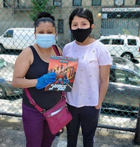 Electrical Industry workers wearing masks at community event.